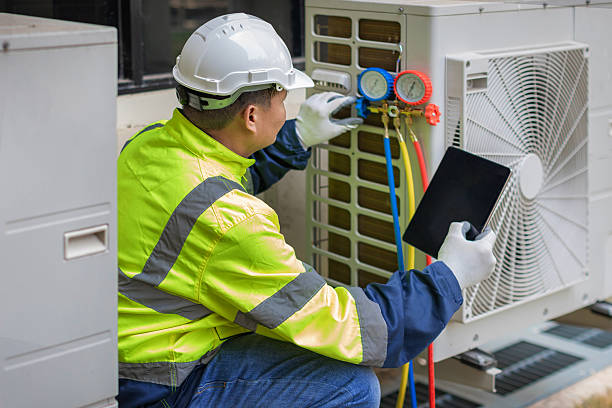 Professional Hvac technician working in Sand Lake, MI